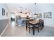 Open concept dining area adjacent to the kitchen, perfect for entertaining at 8889 Cabot Cliffs Dr # 104, Davenport, FL 33896