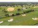 Aerial view of a golf course with lush green fairways and sand traps at 8889 Cabot Cliffs Dr # 104, Davenport, FL 33896