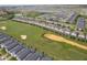 Aerial view of community with numerous houses and a golf course at 8889 Cabot Cliffs Dr # 104, Davenport, FL 33896