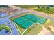 Aerial view of community tennis courts with ample parking at 8889 Cabot Cliffs Dr # 104, Davenport, FL 33896