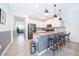 Modern kitchen with stainless steel appliances and a breakfast bar at 8889 Cabot Cliffs Dr # 104, Davenport, FL 33896