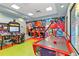 Community game room with air hockey and arcade games at 8889 Cabot Cliffs Dr # 104, Davenport, FL 33896