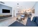 Open living room, kitchen, and dining area with modern decor at 8889 Cabot Cliffs Dr # 104, Davenport, FL 33896