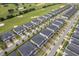 Aerial view of townhouses situated next to a golf course at 8889 Cabot Cliffs Dr # 104, Davenport, FL 33896