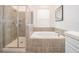 Spa-like bathroom featuring a large soaking tub and separate shower at 8889 Cabot Cliffs Dr # 104, Davenport, FL 33896