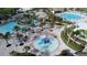 Aerial view of resort-style pool with water features and a playground at 8889 Cabot Cliffs Dr # 104, Davenport, FL 33896