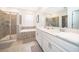 Elegant bathroom with double vanity, soaking tub, and walk-in shower at 8889 Cabot Cliffs Dr # 104, Davenport, FL 33896