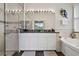 Elegant bathroom with double vanity, soaking tub, and glass shower at 2907 Sunset Lakes Blvd, Kissimmee, FL 34747