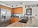 Kitchen with granite countertops and stainless steel appliances at 2907 Sunset Lakes Blvd, Kissimmee, FL 34747