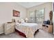 Bedroom with a full-size bed, dresser and window at 2907 Sunset Lakes Blvd, Kissimmee, FL 34747