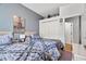 Two twin beds, built-in shelving, and a view of another room at 2907 Sunset Lakes Blvd, Kissimmee, FL 34747
