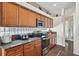 Kitchen with granite countertops and stainless steel appliances at 2907 Sunset Lakes Blvd, Kissimmee, FL 34747