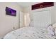 Bedroom with a queen bed, a large closet, and TV at 2907 Sunset Lakes Blvd, Kissimmee, FL 34747