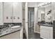 Bathroom with granite countertop, single sink, and large mirror at 2907 Sunset Lakes Blvd, Kissimmee, FL 34747
