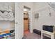 Laundry room with shelving, dresser, and printer at 2907 Sunset Lakes Blvd, Kissimmee, FL 34747
