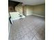 Spacious living room with tile flooring and a staircase at 6091 Village Cir # Ge, Orlando, FL 32822