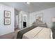 Bedroom with a large bed, two wall art pieces, and a dresser at 1955 Hemingway Cir, Groveland, FL 34736