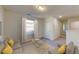 Upstairs loft area furnished with a couch, chairs, and coffee table at 1955 Hemingway Cir, Groveland, FL 34736