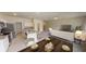 Open concept kitchen and dining area with large wooden table at 1955 Hemingway Cir, Groveland, FL 34736