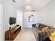 Common area with TV and comfortable seating at 8976 Amelia Downs Trl, Kissimmee, FL 34747