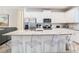 Kitchen island with seating and quartz countertops at 8976 Amelia Downs Trl, Kissimmee, FL 34747