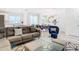 Comfortable living room with sectional sofa and adjacent dining area at 8976 Amelia Downs Trl, Kissimmee, FL 34747