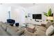 Relaxing living room with sectional sofa and entertainment center at 8976 Amelia Downs Trl, Kissimmee, FL 34747