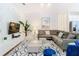Open living room with sectional sofa and stylish decor at 8976 Amelia Downs Trl, Kissimmee, FL 34747