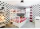 bedroom with bunk beds and polka dot wall at 8976 Amelia Downs Trl, Kissimmee, FL 34747
