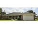 Brick house with a two-car garage and nice landscaping at 2727 N Juliet Dr, Deltona, FL 32738