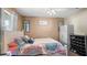 Charming bedroom with a queen bed and white wooden frame at 2727 N Juliet Dr, Deltona, FL 32738