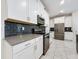 Modern kitchen with stainless steel appliances and dark-grey countertops at 1429 Happy Bird Ln, Winter Springs, FL 32708