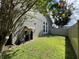 Landscaped backyard with grassy area and privacy fence at 14534 Potanow Trl, Orlando, FL 32837