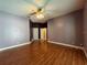 Large bedroom with hardwood floors and double door closet at 14534 Potanow Trl, Orlando, FL 32837