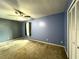 Bright bedroom with neutral walls, ceiling fan, and carpet at 14534 Potanow Trl, Orlando, FL 32837