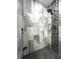 Modern shower with marble tile and a rain shower head at 14534 Potanow Trl, Orlando, FL 32837