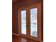 French doors open to the outside patio area with pool view at 14534 Potanow Trl, Orlando, FL 32837