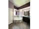 Elegant bathroom featuring a corner tub and double vanity at 14534 Potanow Trl, Orlando, FL 32837