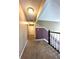 Upstairs hallway with carpeted floors and neutral walls at 14534 Potanow Trl, Orlando, FL 32837