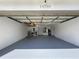 Attached garage with painted floor and storage at 14534 Potanow Trl, Orlando, FL 32837