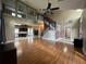 Two-story living room with hardwood floors, high ceilings, and a staircase at 14534 Potanow Trl, Orlando, FL 32837