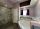 Bathroom with soaking tub and walk-in shower at 14534 Potanow Trl, Orlando, FL 32837