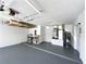 Two-car garage with overhead storage and utility area at 14534 Potanow Trl, Orlando, FL 32837