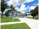 Two-story house with palm trees and driveway at 14534 Potanow Trl, Orlando, FL 32837