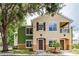 Two-story townhome with green and beige exterior at 4316 S Kirkman Rd # 1602, Orlando, FL 32811