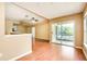 Spacious living area with wood floors and sliding doors to balcony at 4316 S Kirkman Rd # 1602, Orlando, FL 32811