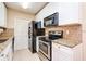 Modern kitchen features granite countertops and stainless steel appliances at 4316 S Kirkman Rd # 1602, Orlando, FL 32811