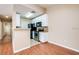 Kitchen with breakfast bar and hardwood floors at 4316 S Kirkman Rd # 1602, Orlando, FL 32811
