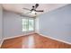 Well-lit bedroom with wood floors and ceiling fan at 4316 S Kirkman Rd # 1602, Orlando, FL 32811