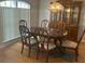 Elegant dining room with a large table and hutch at 4260 Climbing Aster Ct, Saint Cloud, FL 34772